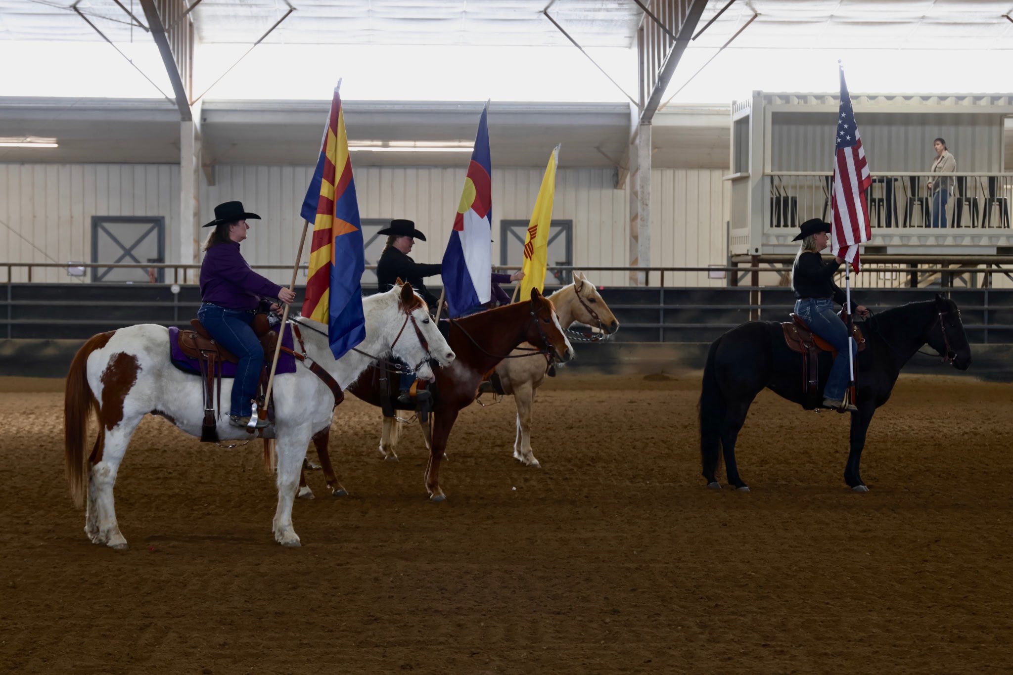 Three riders with state flags